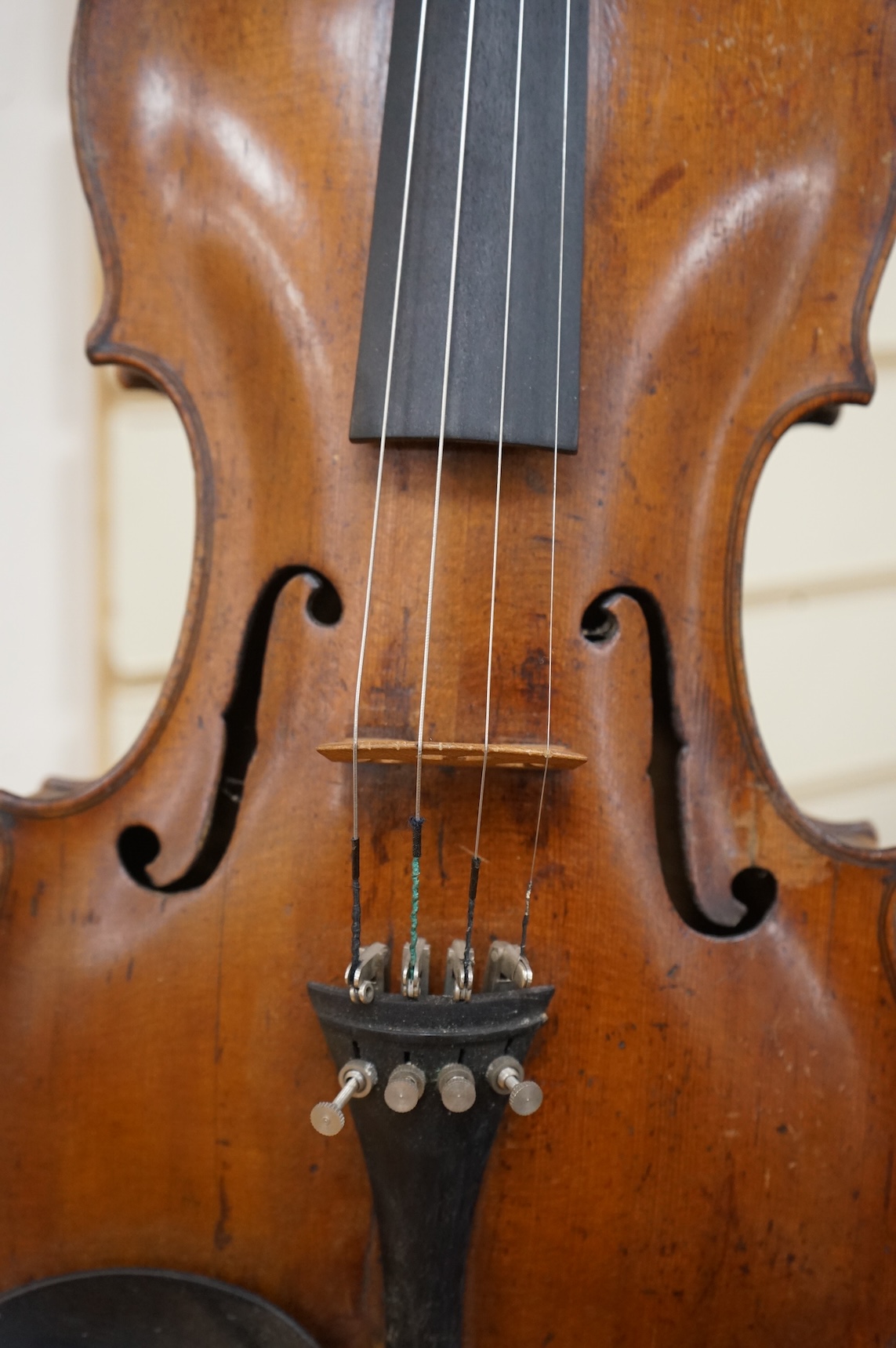 A late 18th century cased English violin, possibly after Richard Duke, length of body 35.5cm.